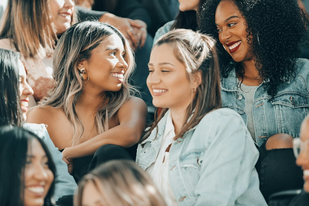 crowd laughing together