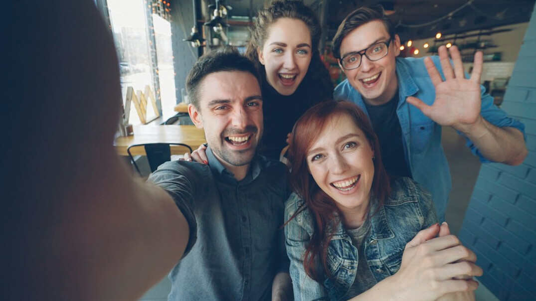 group of friends posing for photo