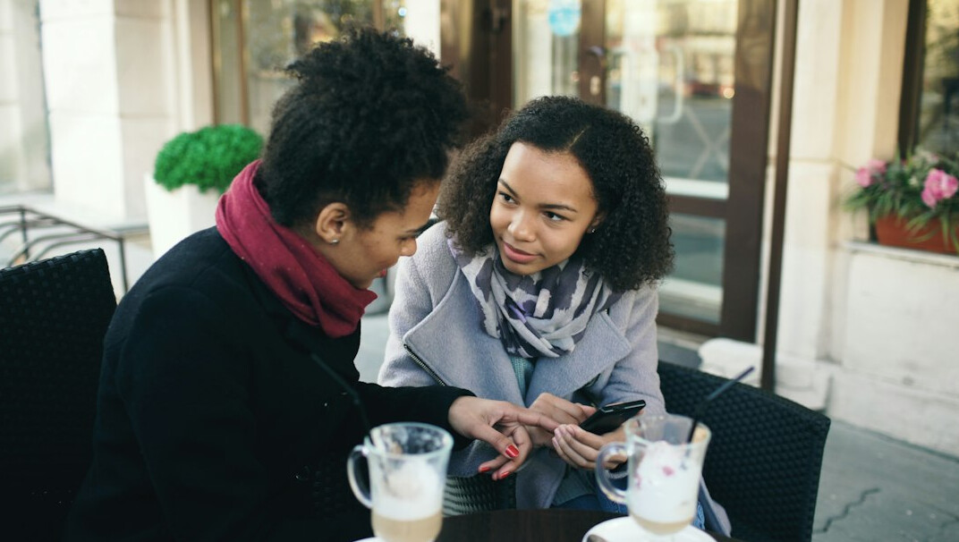 diverse people discussing in cafe
