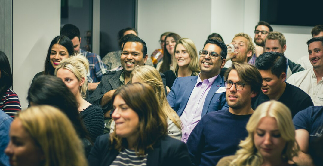 crowd laughing together
