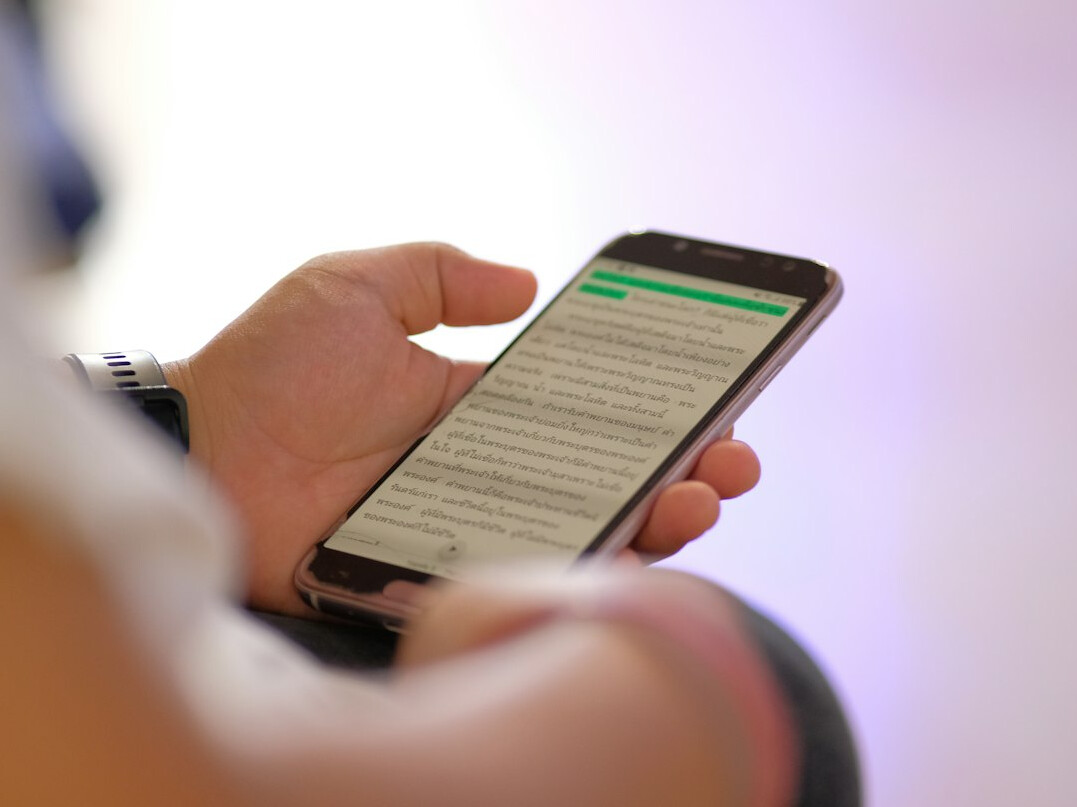 person reading news on phone